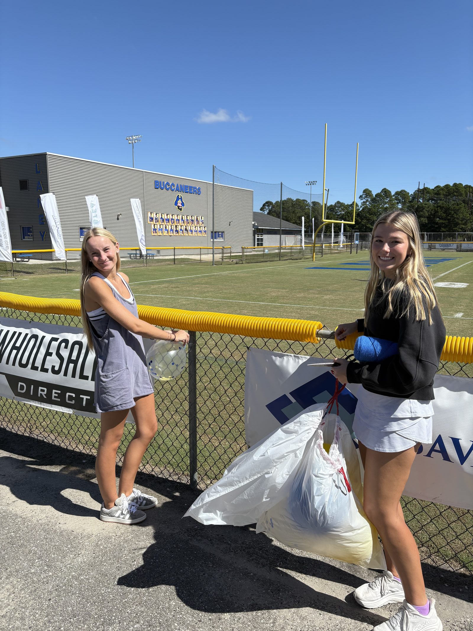 Laney NHS members cleaning up the football field