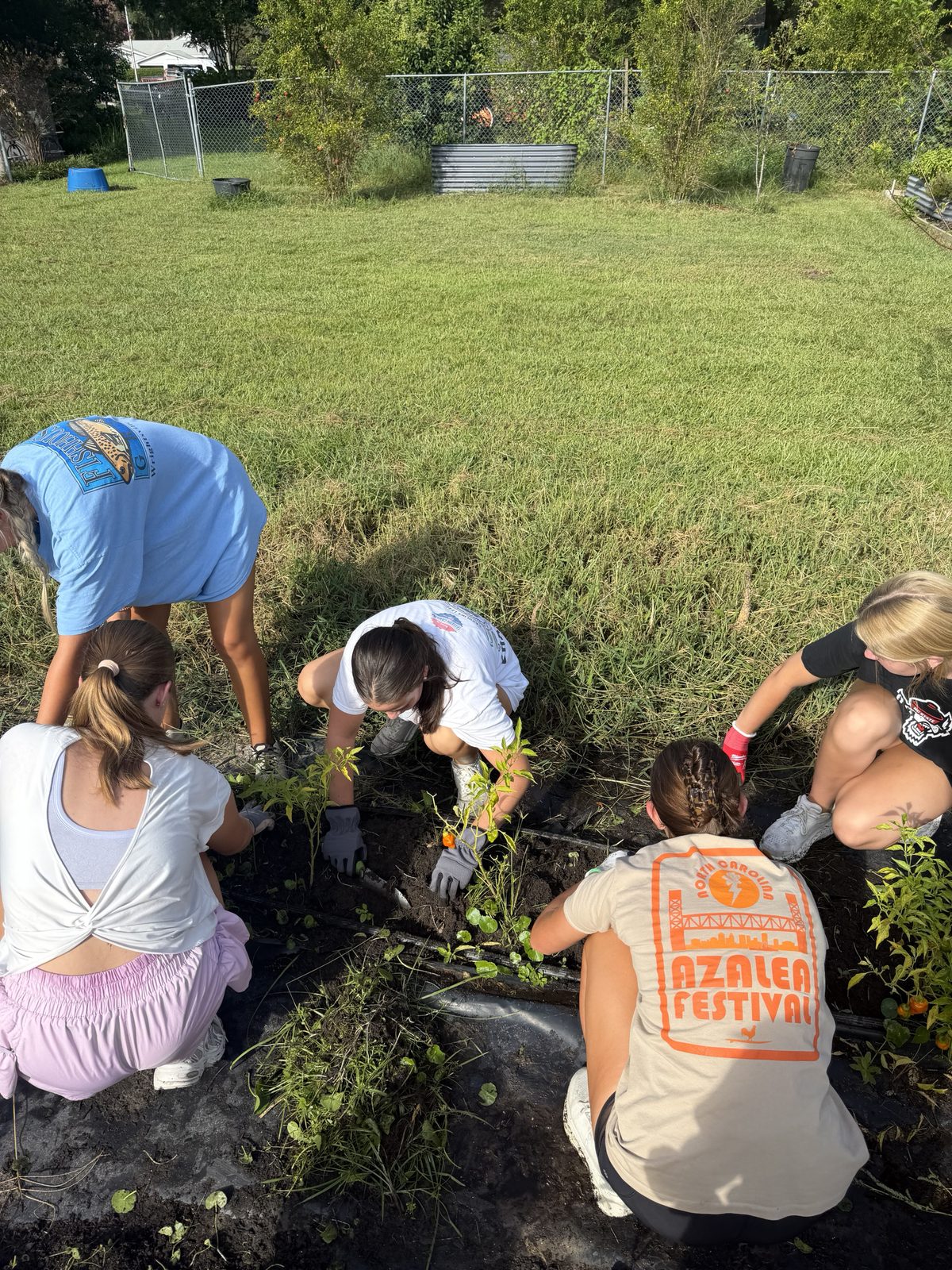 Laney NHS members planting at Willowdale Farms