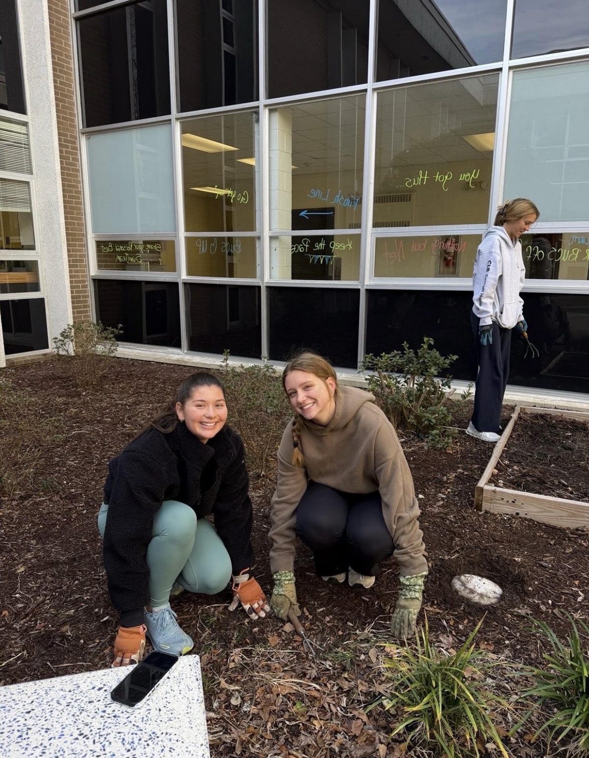 Laney NHS members gardening at school