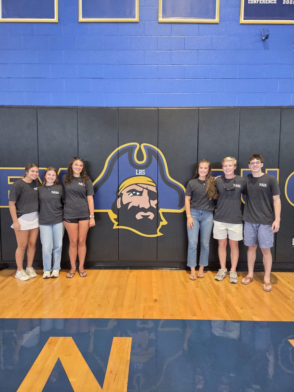 Laney NHS officers in front of the Buccaneer mural